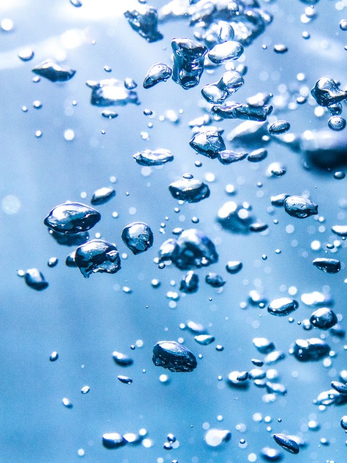 who-we-are Detailed shot of air bubbles underwater captured in the Windward Islands, French Polynesia.